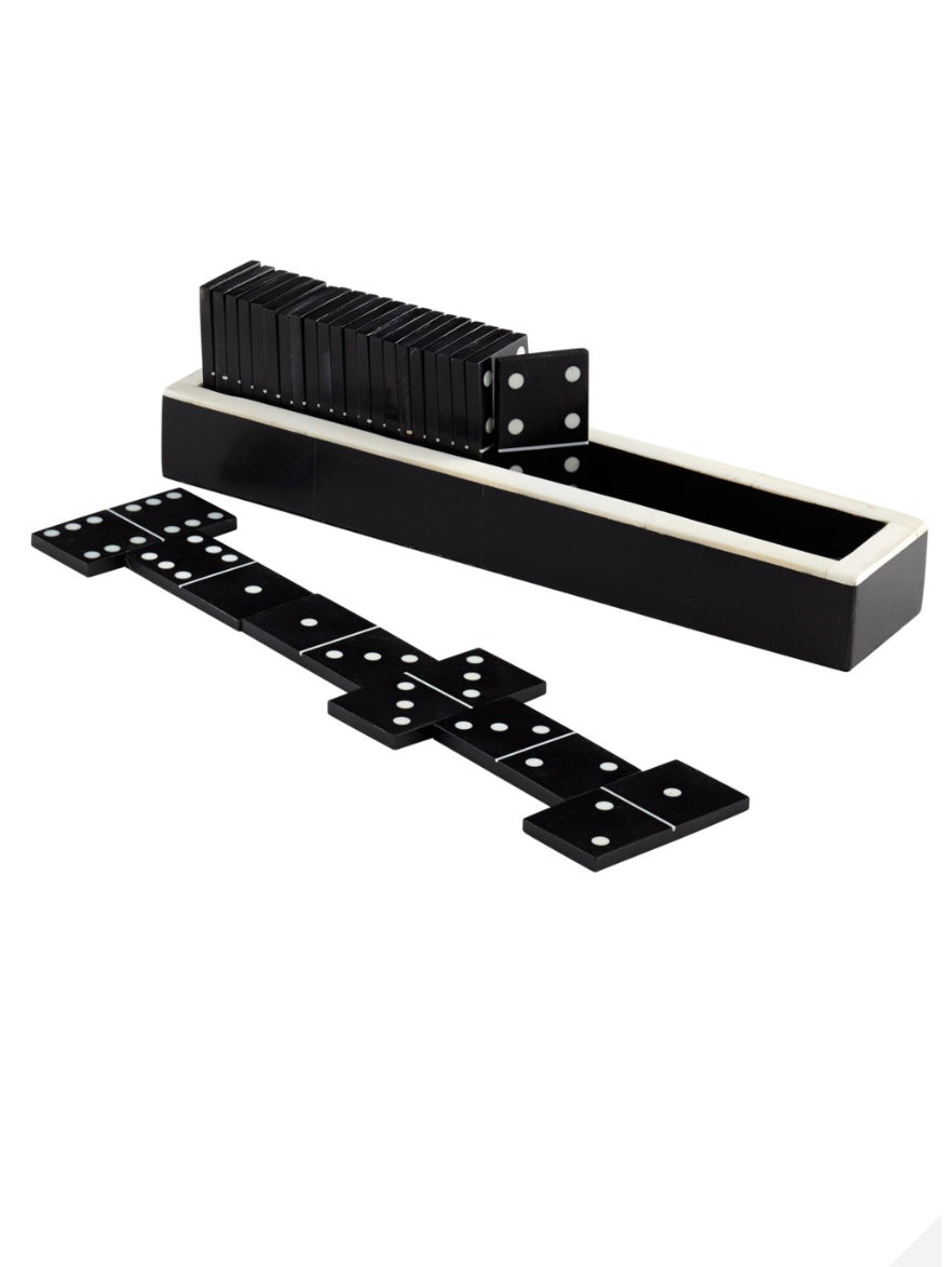 Dominoes  Bring an element of fun and strategy to a coffee table or a home office credenza with this game inspired dominoes sculpture. Interactively move the black and white pieces around for a fascinating and engaging artistic experience  Dimensions: H 2 x W 8.5 x Depth 1.75  Finish: Black and White Materials: Horn