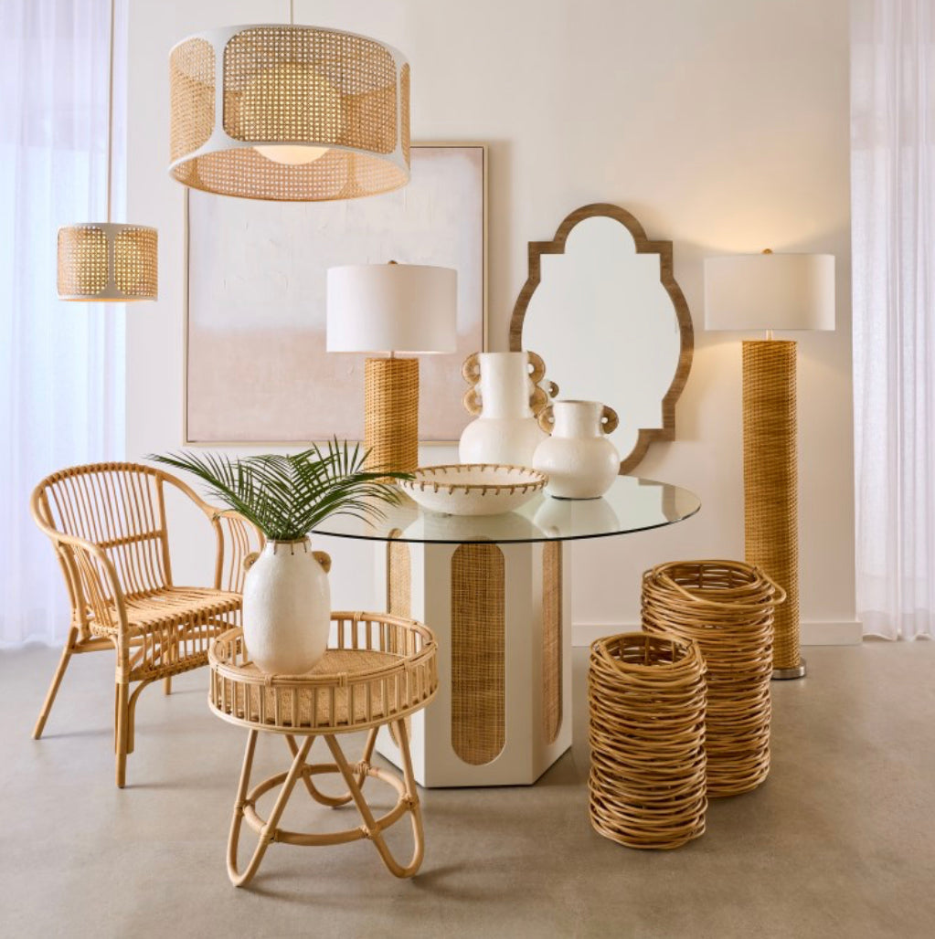 The Clearwater Dining Table has a hexagonal wooden base with woven rattan panels in a white washed finish on each side.  I The table's round top is made from clear tempered glass. The breezy look of this pedestal table has a decidedly coastal feel.   Dimensions:54" W x 54" D x 30" H  Weight:73lbs