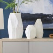 The Aggie Vase is a sculptural, faceted frosted glass vase with a matte white finish and an elongated body. This vase is perfect for a Scandinavian or coastal look.