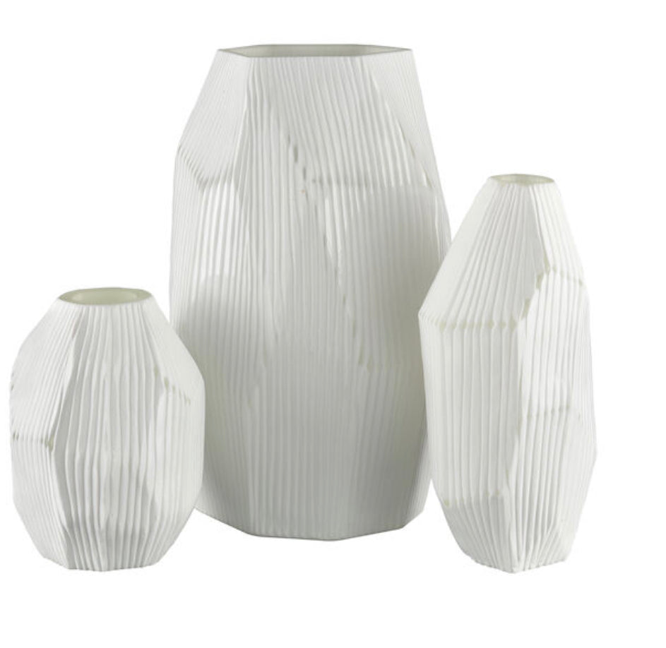 The Aggie Vase is a sculptural, faceted frosted glass vase with a matte white finish and an elongated body. This vase is perfect for a Scandinavian or coastal look.