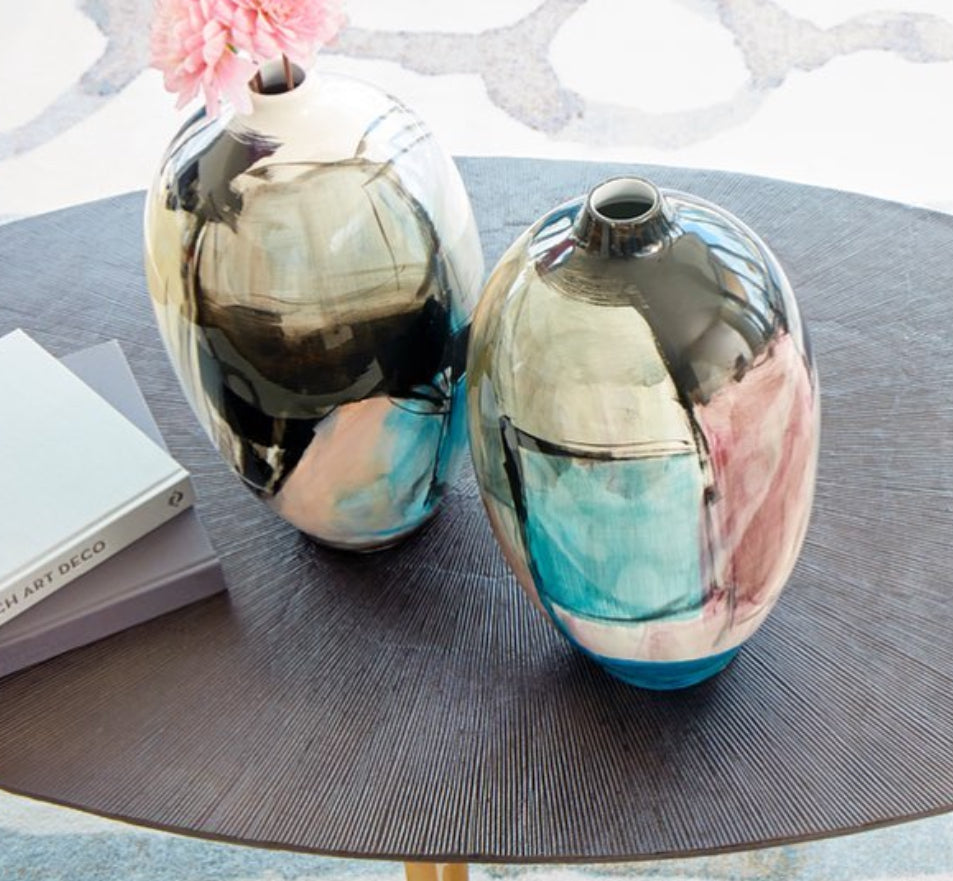  Hand-Blown Glass Vases look amazing when filled with miniature flowers, individual buds, and cut remnants of large bouquets as they begin to rot. Our vases are not only very clear but also very sturdy, which makes them the perfect combination of functionality and artistic beauty. The vase is perfect as a home accent or as a wedding decoration. Carmen Vase is the perfect tabletop glassware accent, showcasing an abstract brush stroke in a vibrant colorful finish.