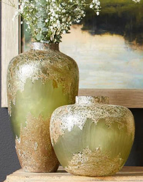 The Alkali vase features an alternating rugged, smooth textured surface in a Forest Stone (green) finish. his vase is a decorative anchor and as a functional storage component for your floral bouquets and branches.
