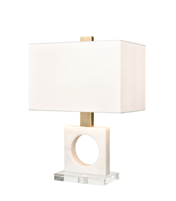 Great for a contemporary or elevated transitional style living room, hallway or bedroom, the Acres Court Table Lamp features an eye catching sculptural base made from a square piece of marble with a circular, cut out center.  This design sits on a clear crystal base and has metal appointments in a rich, antique brass finish. Its striking profile is topped with a rectangular, hardback shade in white linen.   Dimensions:15" W x 9" D x 21.75"
