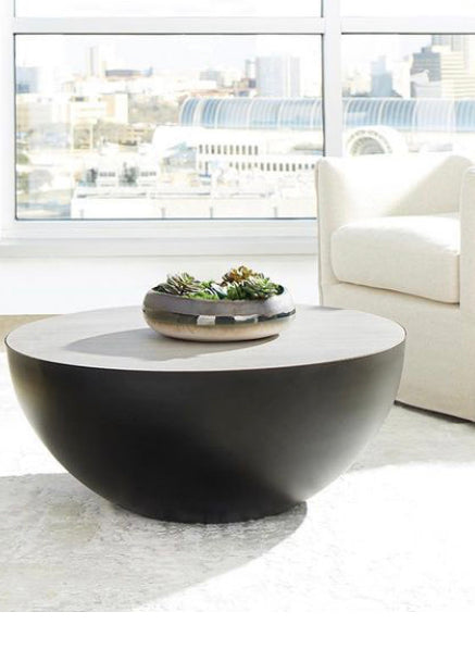 The Balance coffee table is the epitome of simplistic decor. Sophisticated, with a striking geometric inspiration, this furnishing also marries elements of natural design into its overall look. A perfect graphite semi-circle balances the wooden surface-top for a look that toes the line of modern/eclectic.