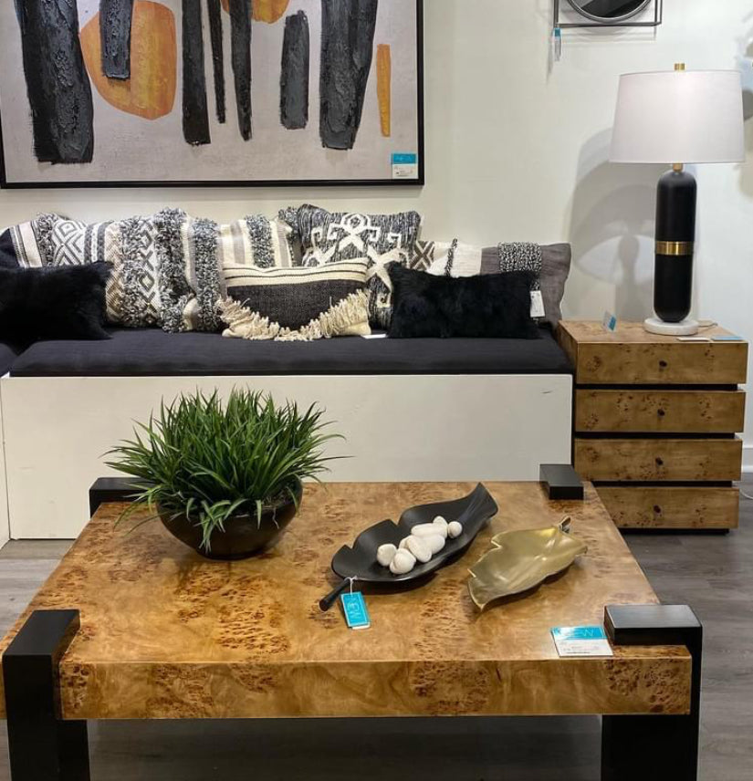  The Bromo Chest has a beautiful mappa burl wood surface and solid hardwood legs in a painted finish which clamp around the tabletop, creating a dynamic geometric look.  This square end table offers a versatile surface in a living room, bedroom or seating 