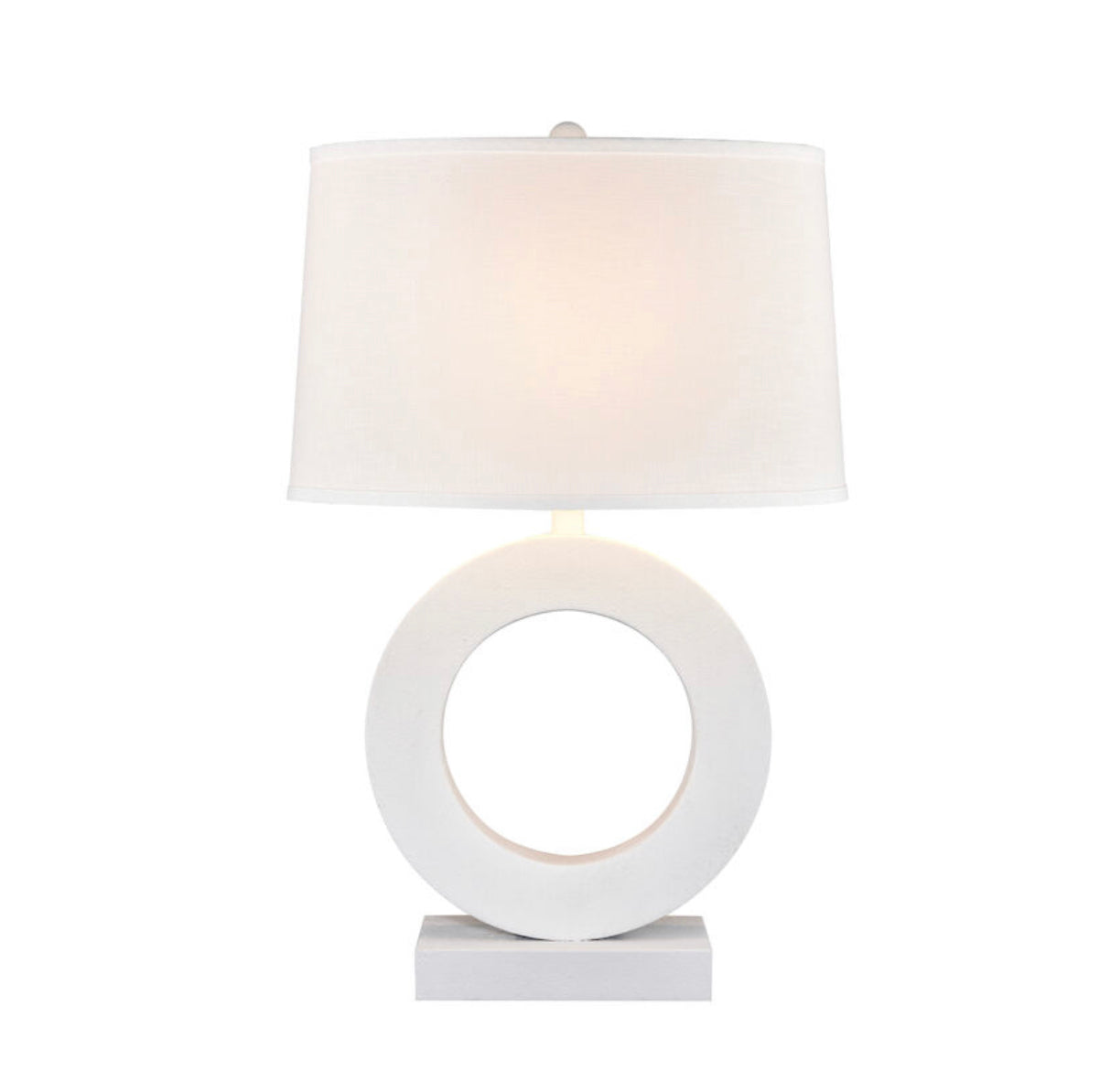 Ideal for a contemporary living room or hallway, the Around The Edge Table Lamp features a circular composite body in a sleek matte finish. Its bold, sculptural silhouette is complemented by an oval hardback shade in off white linen.  Dimensions:21" W x 13.5" D x 32" H